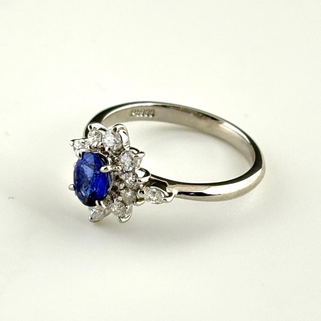 SAPPHIRE DESIGN PLATINUM MELEE DIAMOND RING: sapphire design Platinum Melee diamond Ring Brand: Unbranded Type: Ring Material: Pt900, Main Stone/Creation sapphire Color: Platinum Size: US 6 to 6.5 Accessories: None Accessories Notice