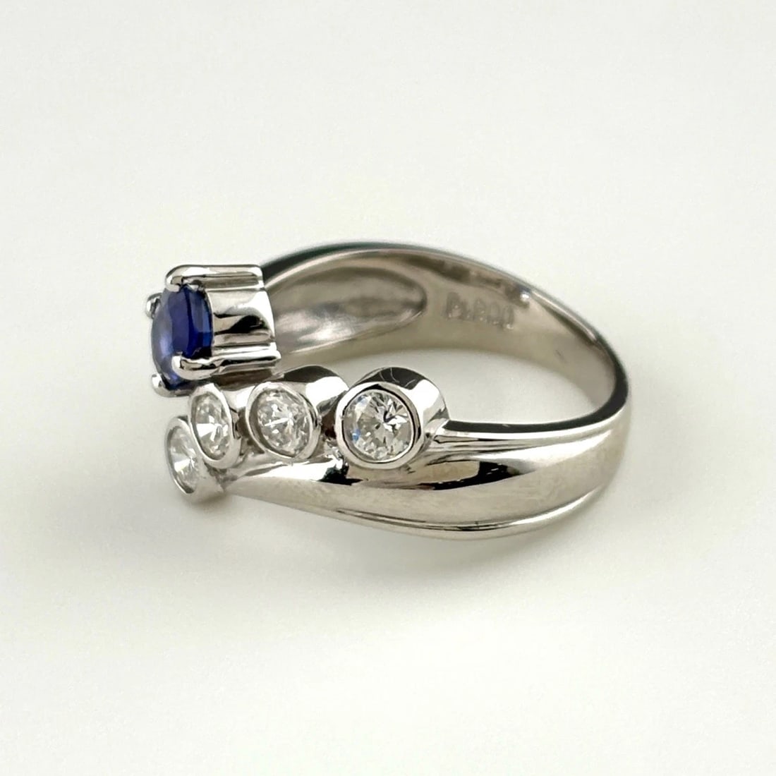 SAPPHIRE DESIGN PLATINUM MELEE DIAMOND RING: sapphire design Platinum Melee diamond Ring Brand: Unbranded Type: Ring Material: Pt900, Main Stone/Creation sapphire Color: Platinum Size: US 6.5 Accessories: None Accessories Notice: Whe