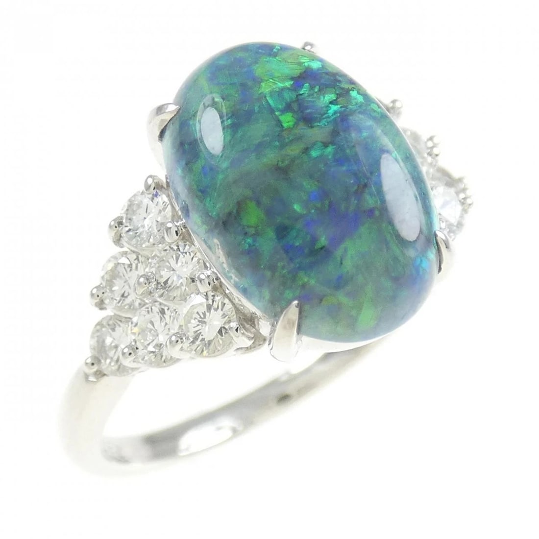 PT900 BLACK OPAL RING: PT900 Black Opal Ring Brand: Unbranded Type: Ring Material: Platinum 900, Main Stone/Creation Black OpalSide Stone Natural Color: Silver Size: 7 (US size) Accessories: None Accessories