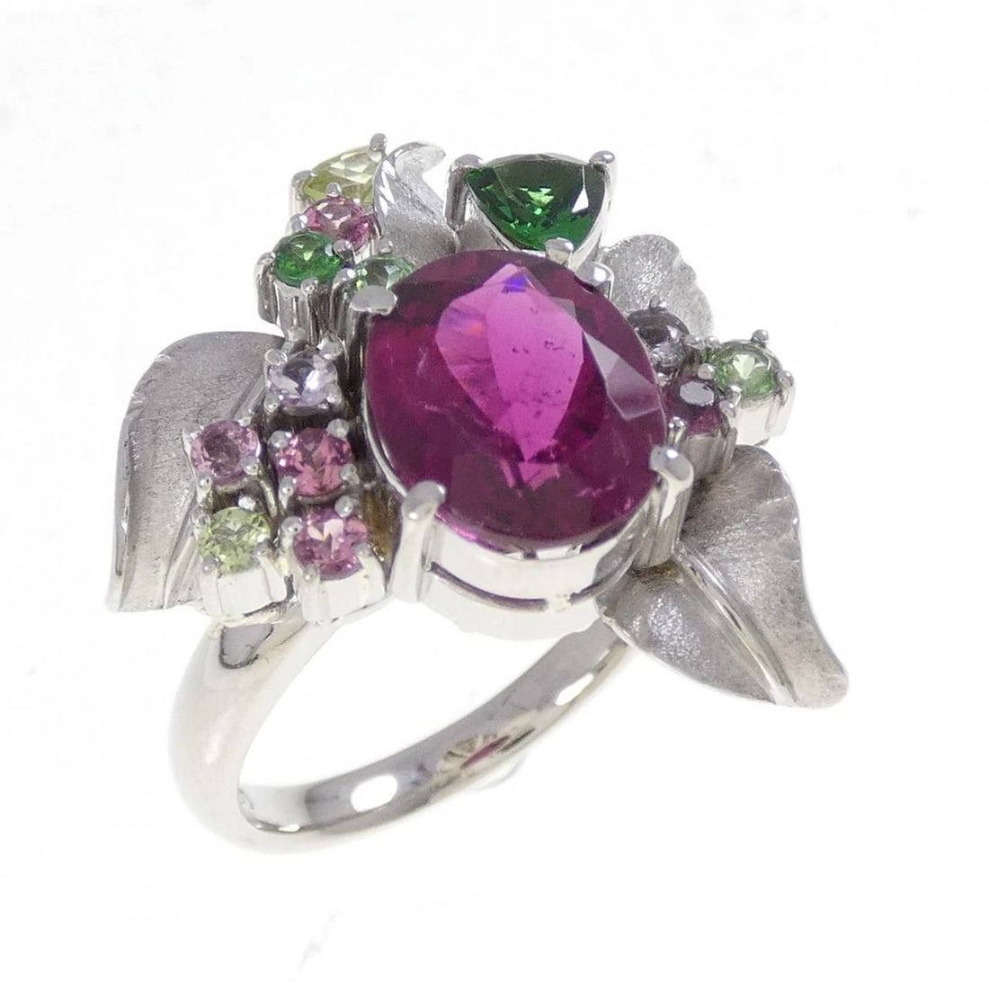 PT900 RUBELLITE TOURMALINE RING: PT900 Rubellite Tourmaline Ring Brand: Unbranded Type: Ring Material: Platinum 900, Main Stone/Creation Rubellite TourmalineSide Stone Tourmaline Topaz Garnet Peridot Color: Silver Size: 7-7.5