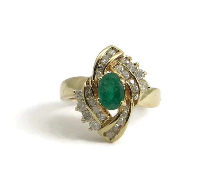 VINTAGE OVAL GREEN EMERALD AND DIAMOND COCKTAIL RING: Vintage Oval Green Emerald and Diamond Cocktail Ring Brand: Estate Type: Ring Material: 14K yellow gold, Main Stone/Creation Natural Color: Green Size: 6.25 US Accessories: None Accessories