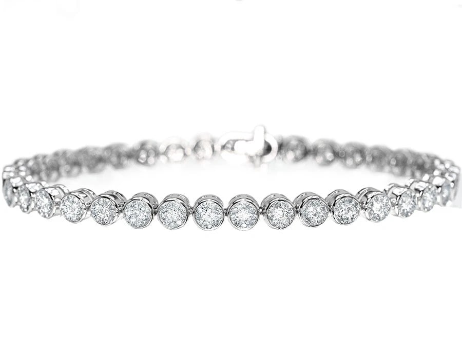 10K WHITE GOLD ROUND CUT SOLITAIRE BEZEL DIAMOND TENNIS BRACELET: 10k White Gold Round Cut Solitaire Bezel Diamond Tennis Bracelet Brand: None Type: Bracelet Material: 10k White Gold, Main Stone/Creation Natural Color: White Size: Width 4.5mm Length 7 in. Acces