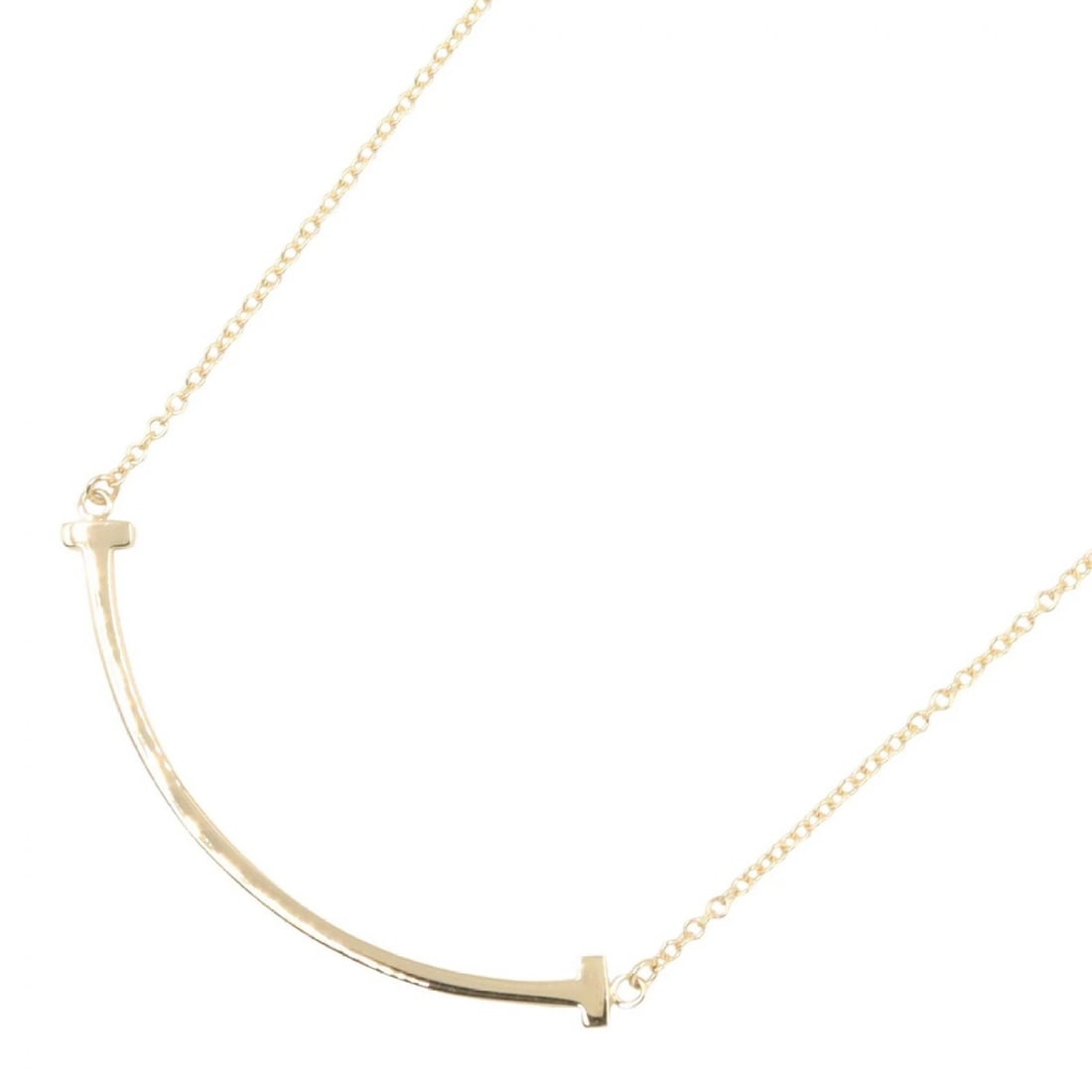 TIFFANY?CO T SMILE SMALL NECKLACE 18KYG: TIFFANY?CO T Smile Small Necklace 18KYG Brand: TIFFANY?CO Type: Necklace Material: K18 (Yellow Gold) Color: Yellow Gold Size: Size Neck rotation?40/45.5cm(15.7") Motif W?37mm x H?3mm(1.5" x 0.1")