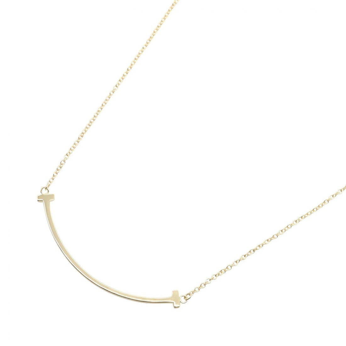 TIFFANY?CO T SMILE SMALL NECKLACE PENDANT 18KYG: TIFFANY?CO T Smile Small Necklace Pendant 18KYG Brand: TIFFANY?CO Type: Necklace Material: K18 (Yellow Gold) Color: Yellow Gold Size: Size Neck rotation?35/37.5cm(13.8") Motif W?35mm x H?3mm(1.4"