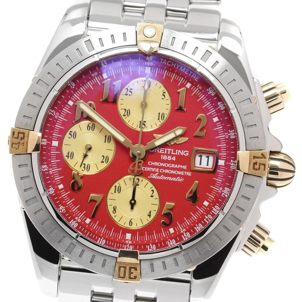 BREITLING CHRONO RED WATCH: BREITLING Chrono Red Watch Brand: BREITLING Type: Wristwatch Material: Band Material Stainless Steel, Case Material Stainless Steel/YG Color: Band Color Silver, Dial Color Red, Case Color Silver /