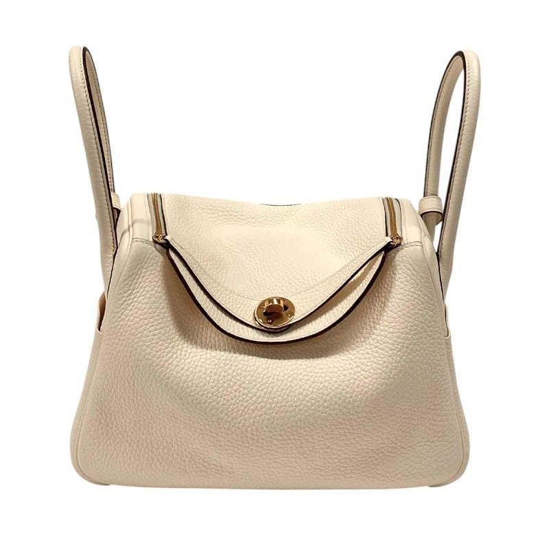 HERMES LINDY 26 SHOULDER BAG: HERMES Lindy 26 Shoulder Bag Brand: HERMES Type: Shoulder Bag Material: Taurillon Clemence Color: Nata Gold Hardware Size: W10.2 x H6.7x D5.1inch Accessories: None Accessories Notice: When