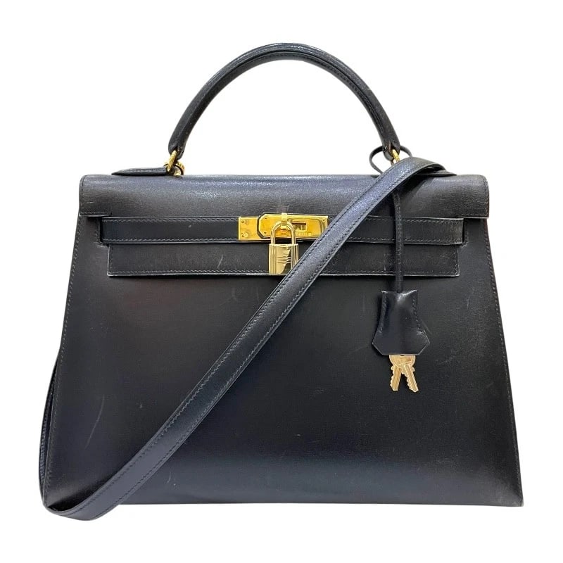 HERMES KELLY 32 OUTSIDE SEWING HANDBAG: HERMES Kelly 32 outside sewing Handbag Brand: HERMES Type: Handbag Material: Box scarf Color: Black Gold Hardware Size: W12.8 x H8.9x D4.5inch Shoulder:32.3inch Accessories: None Accessories