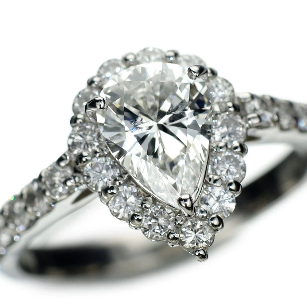 PT900 PEAR SHAPE DIAMOND RING: Pt900 Pear Shape Diamond Ring Brand: None Type: Ring Material: Metal Purity None Metal Pt900 Main Stone/Creation Natural Color: none Size: 5.5 - 5.75 US Accessories: None Accessories Notic