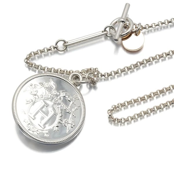 HERMES NECKLACE EX-LIBRIS MM 925 STERLING SILVER: HERMES Necklace Ex-Libris MM 925 Sterling Silver Brand: HERMES Type: Necklace Material: 925 / Sterling Silver 18K / 750 / Rose Gold Color: Silver,Gold Size: Necklace length: 50cm Pendant size: