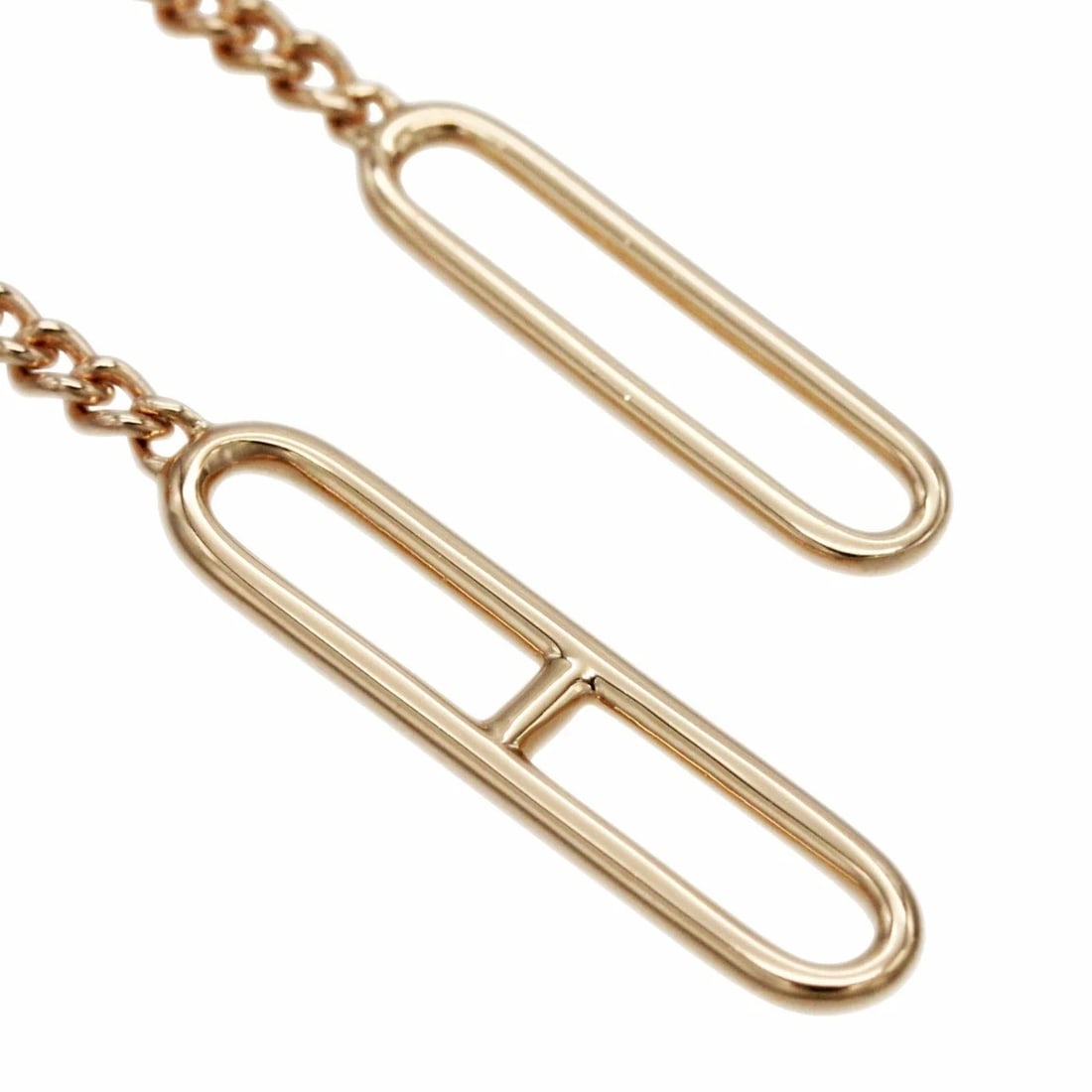HERMES ECHAPPEE ASYMMETRY 18K ROSE GOLD LONG DANGLE: Hermes Echappee Asymmetry 18k Rose Gold Long Dangle Brand: HERMÈS Type: Earrings Material: 18k Rose Gold Color: Gold Size: . 15 × 63 mm / Approx. 0.6 × 2.5 in Accessories: None Accessories
