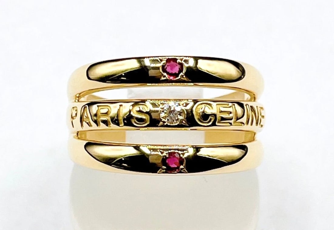 CELINE PARIS 18K YELLOW GOLD DIAMOND BAND LOGO RING: Celine Paris 18k Yellow Gold Diamond Band Logo Ring Brand: Celine Type: Ring Material: 18k Yellow Gold Main Stone/Creation Natural Color: Yellow Size: 6.5 US Accessories: None Accessories