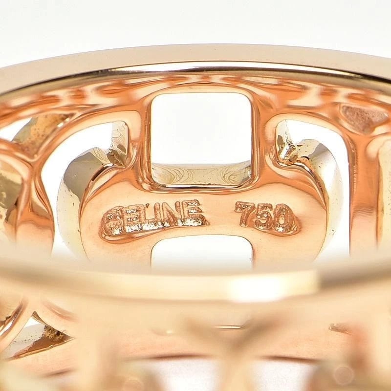 CELINE HORSESHOE OPENWORK PINK SAPPHIRE WIDE BAND RING: Celine Horseshoe Openwork Pink Sapphire Wide Band Ring Brand: Celine Type: Ring Material: 18k Gold Main Stone/Creation Natural Color: Gold Size: 5.75 US Accessories: None Accessories Notice: