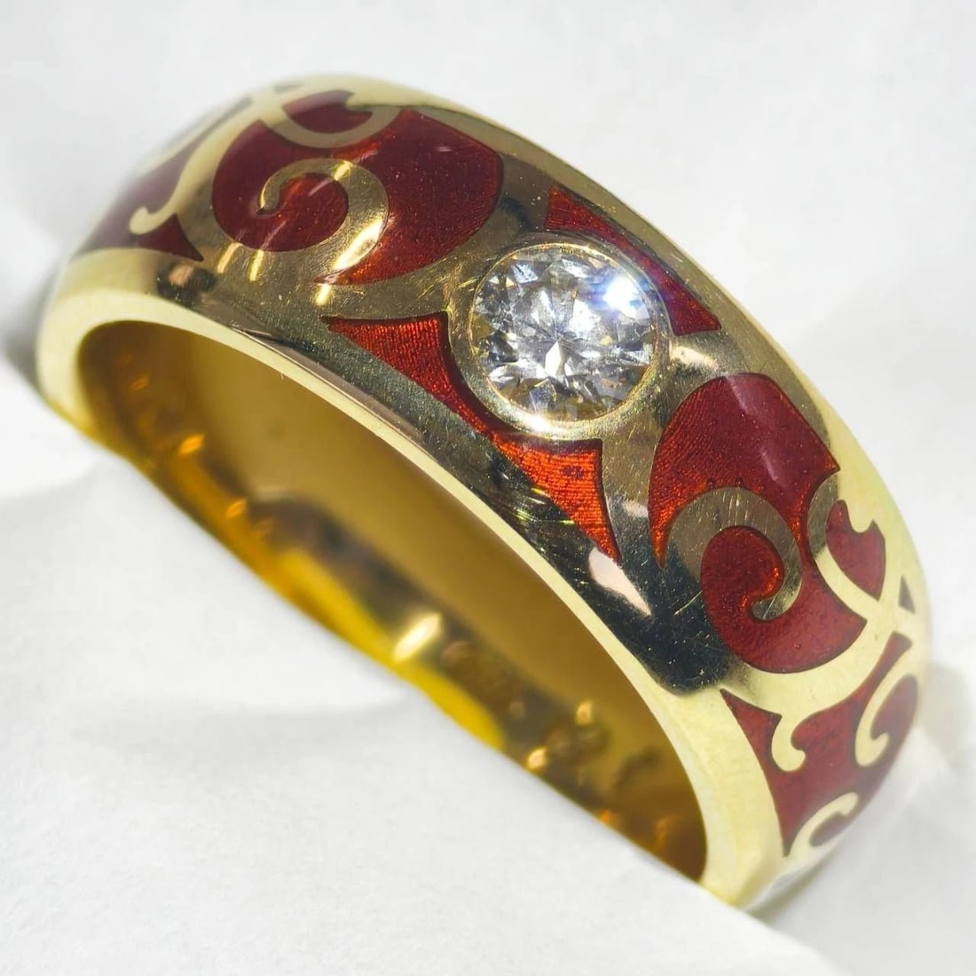 ZERRENNER DIAMOND 18K GOLD AND RED ENAMEL BAND RING: Zerrenner Diamond 18k Gold and Red Enamel Band Ring Brand: Zerrenner Type: Ring Material: 18k Gold Main Stone/Creation Natural Color: Gold Size: 6.5 US Accessories: None Accessories Notice: