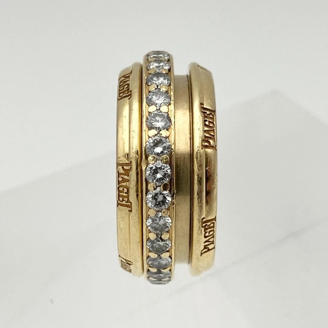 PIAGET POSSESSION DIAMOND SPINNER BAND RING: Piaget Possession Diamond Spinner Band Ring Brand: Piaget Type: Ring Material: 18k Yellow Gold Main Stone/Creation Natural Color: Yellow Size: 5.75 US Accessories: None Accessories Notice: