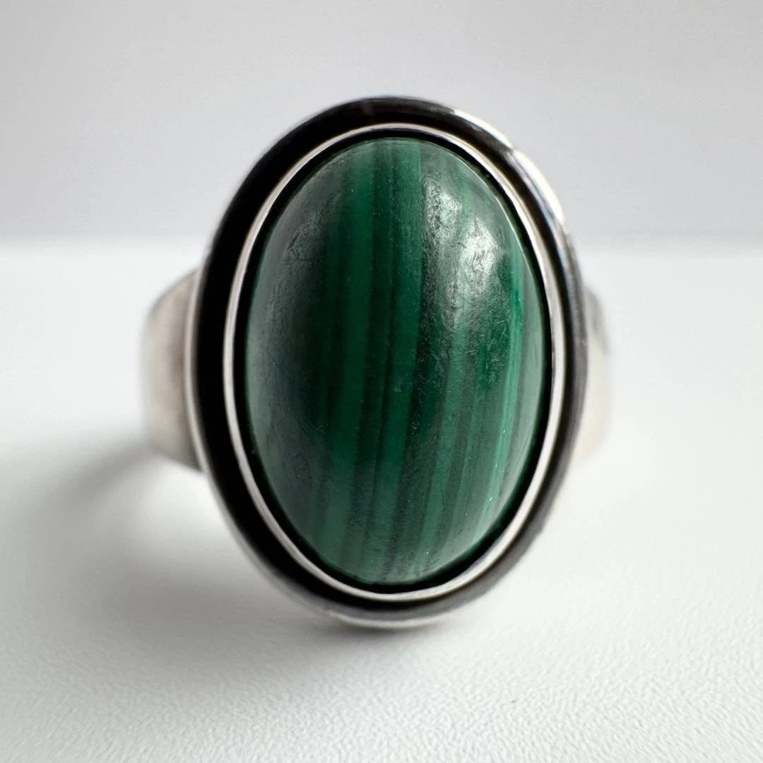 GEORG JENSEN MALACHITE STERLING SILVER RING: Georg Jensen Malachite Sterling Silver Ring Brand: Georg Jensen Type: Ring Material: Sterling Silver 925 Main Stone/Creation Malachite Color: Silver Size: 6 US Accessories: None Accessorie