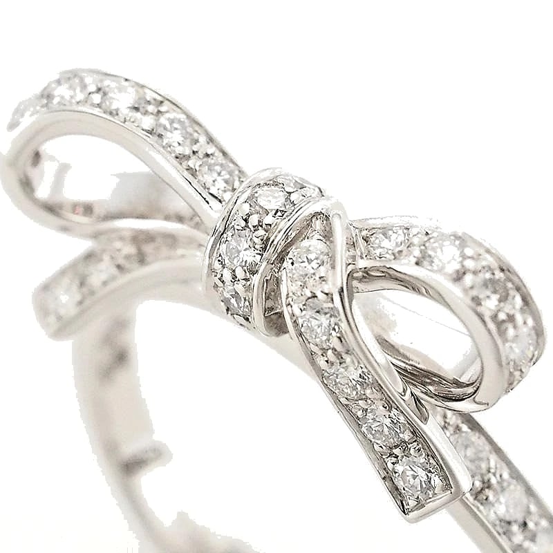 CHRISTIAN DIOR DIAMOND PAVE BOW RIBBON 18K WHITE GOLD RING: Christian Dior Diamond Pave Bow Ribbon 18k White Gold Ring Brand: Dior Type: Ring Material: 18k White Gold Main Stone/Creation Natural Color: White Size: 6 US Accessories: None Accessories
