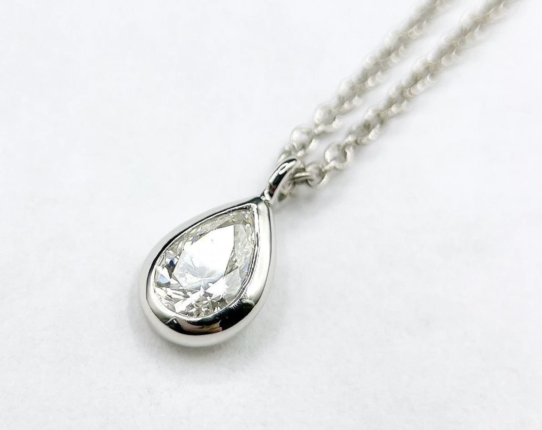 TIFFANY & CO ELSA PERETTI BY THE YARD PEAR SHAPE NECKLACE PENDANT: Tiffany & Co Elsa Peretti By the Yard Pear Shape Necklace Pendant Brand: Tiffany & Co. Type: Necklace Material: Platinum 950 Main Stone/Creation Natural Color: White Size: Chain Length: