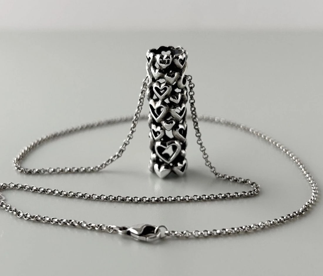 GEORG JENSEN ALLAN SCHARF HEART BY HEART NECKLACE: Georg Jensen Allan Scharf Heart by Heart Necklace Brand: Georg Jensen Type: Necklace Material: Sterling Silver 925 Color: Silver Size: W 1 cm (0.4 inches) x H 3.2 cm (1.3 inches) Chain Length: