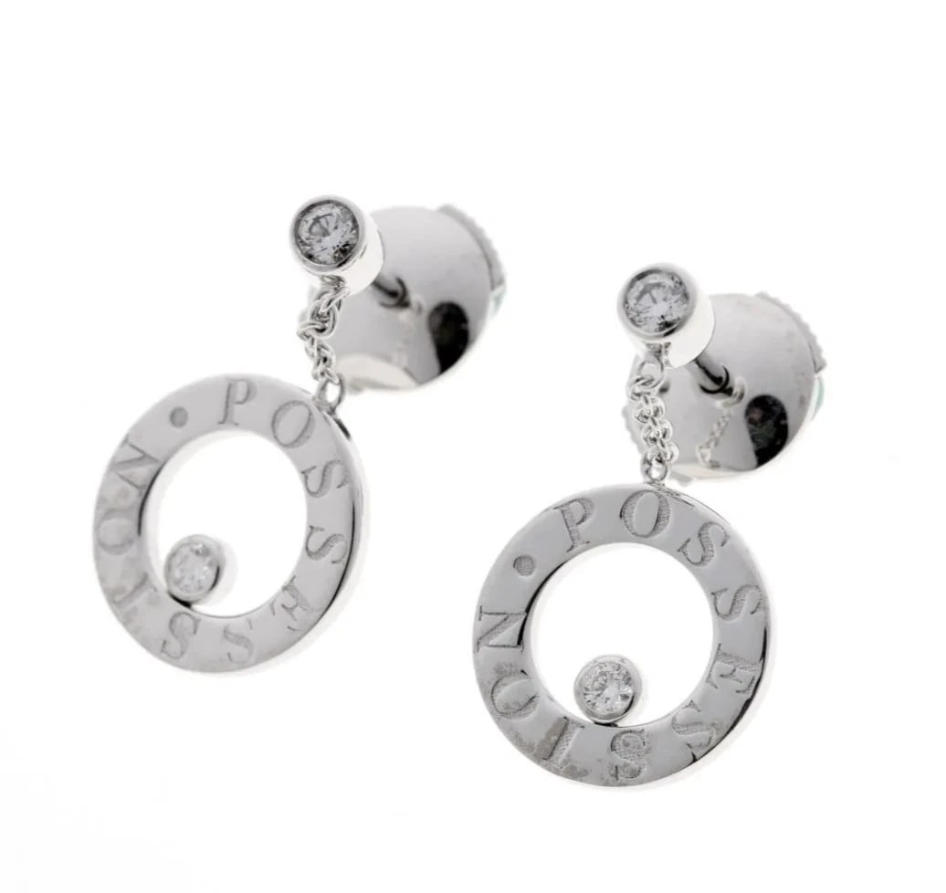 PIAGET POSSESSION DIAMOND 18K WHITE GOLD DANGLE DROP EARRINGS: Piaget Possession Diamond 18k White Gold Dangle Drop Earrings Brand: Piaget Type: Earrings Material: 18k White Gold Main Stone/Creation Natural Color: White Size: : Motif width approx. 11 mm 