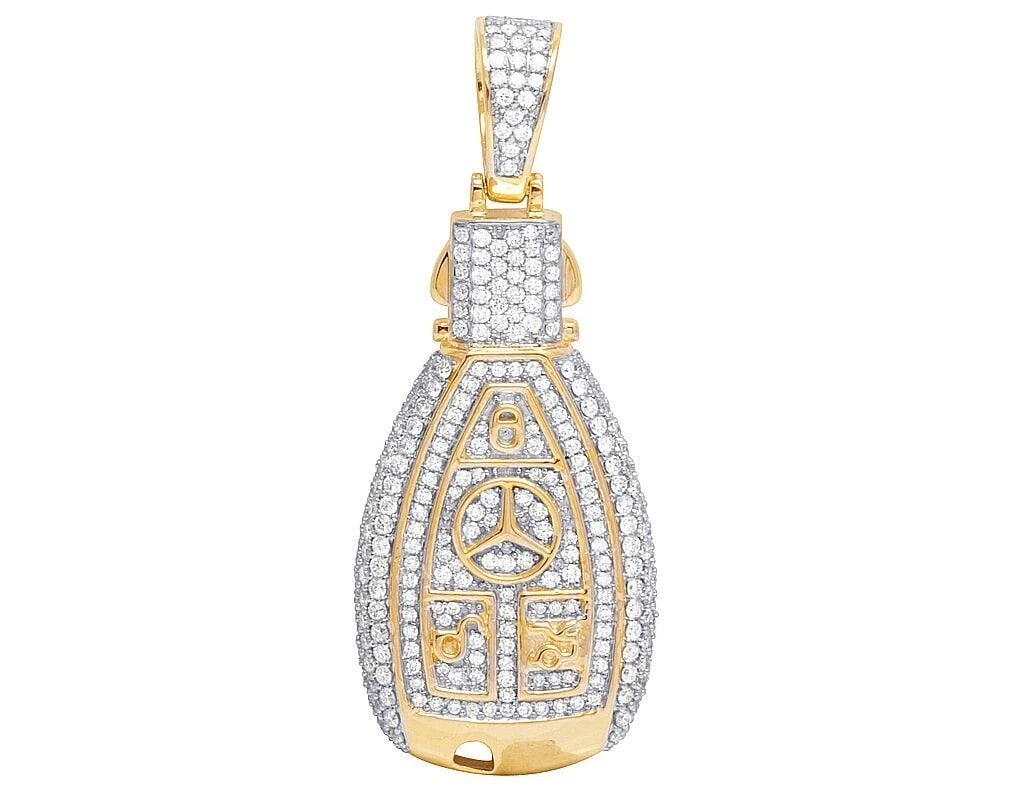 REAL 14K YELLOW GOLD GENUINE DIAMOND MERCEDES KEY PENDANT: Real 14K Yellow Gold Genuine Diamond Mercedes Key Pendant Brand: None Type: Pendant Material: 14k Yellow Gold Main Stone/Creation Natural Color: Yellow Gold Size: Dimension 2" Accessories: None
