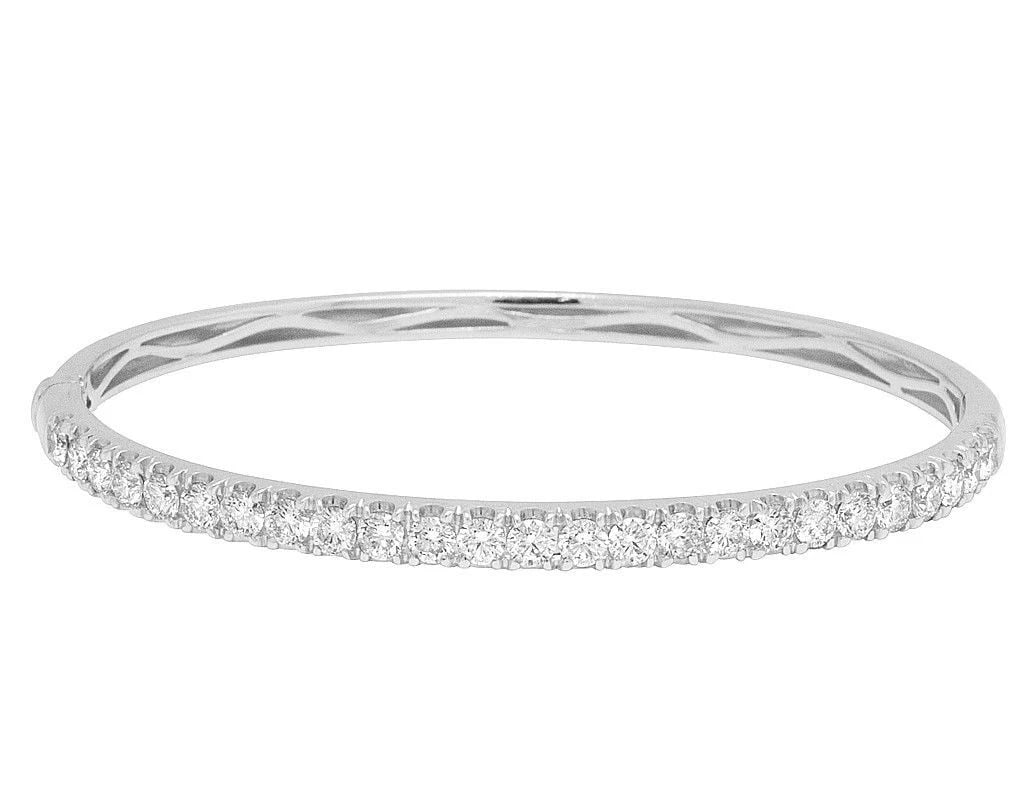 SINGLE ROW SOLITAIRES REAL DIAMOND BANGLE BRACELET: Single Row Solitaires Real Diamond Bangle Bracelet Brand: None Type: Bracelet Material: 10k White Gold Main Stone/Creation Natural Color: White Gold Size: Length 6.5 in Width 4.5 mm Accessories:
