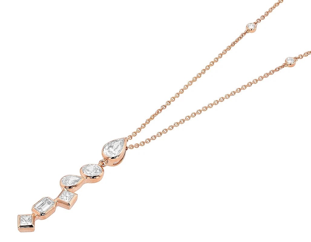 10K ROSE GOLD DIAMOND DROP NECKLACE: 10K Rose Gold Diamond Drop Necklace Brand: None Type: Necklace Material: 14k Rose Gold Main Stone/Creation Natural Color: Rose Gold Size: Necklace Length 18" Width 1MM Accessories: None Ac