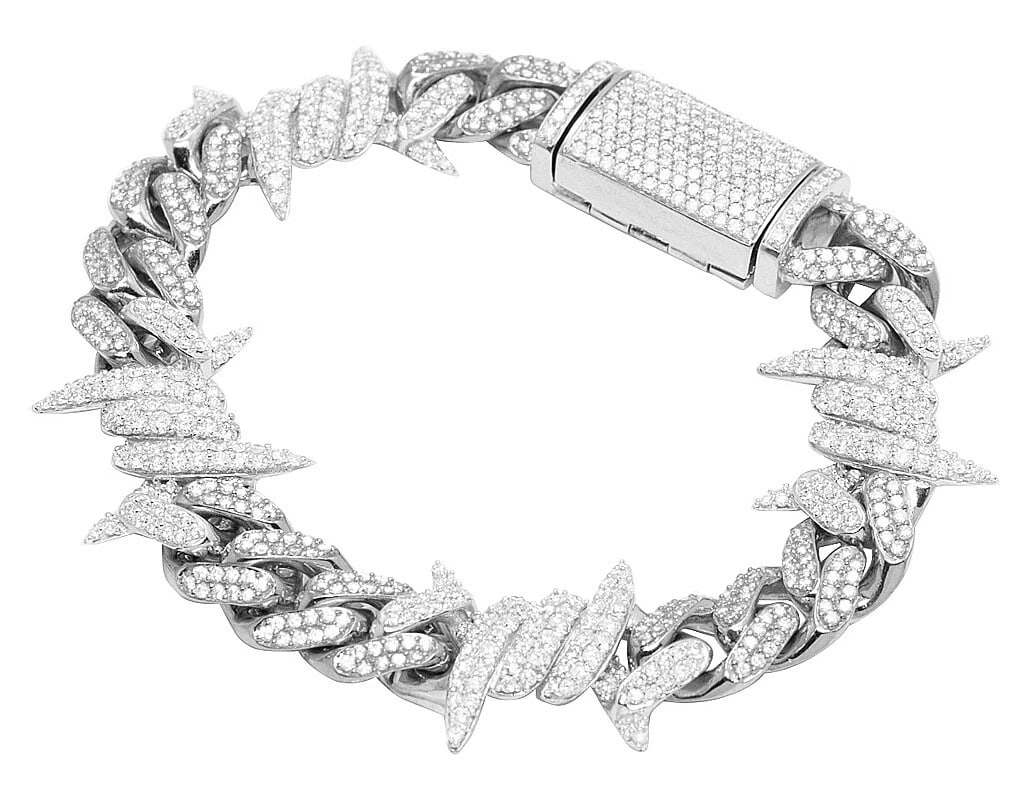 WHITE GOLD THORN CUBAN REAL DIAMOND BRACELET: White Gold Thorn Cuban Real Diamond Bracelet Brand: Jewelry Hiphop Type: Necklace Material: 10k White Gold Main Stone/Creation Natural Color: White Gold Size: Dimension 8" 11mm Accessories: None