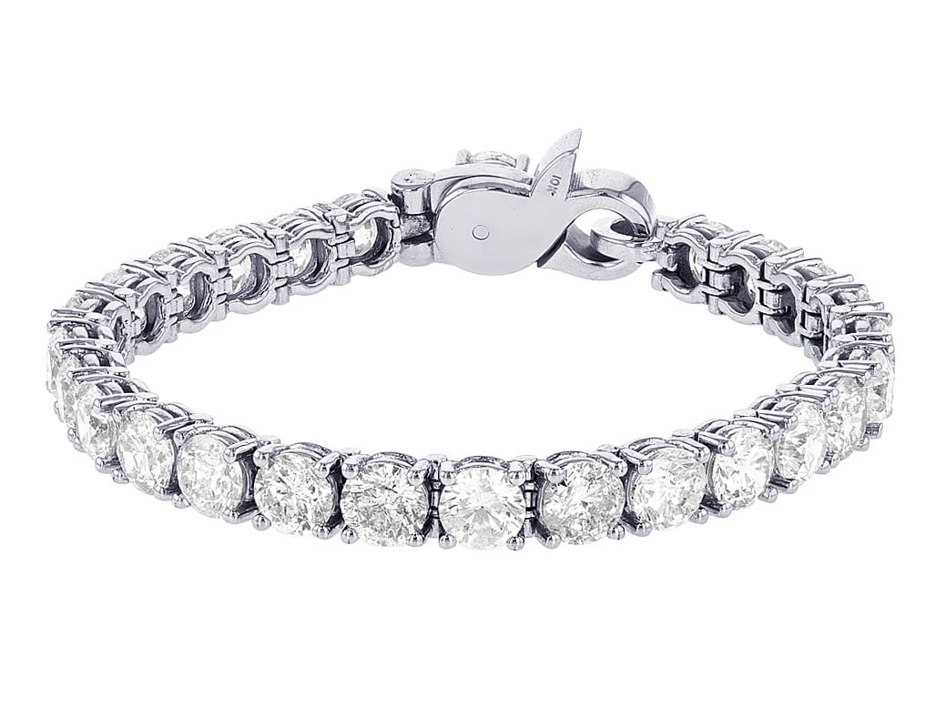 SOLITAIRES REAL DIAMOND 10K WHITE GOLD: Solitaires Real Diamond 10K White Gold Brand: None Type: Bracelet Material: 10k White Gold Main Stone/Creation Natural Color: White Gold Size: Dimension L7.5" W6.5mm Accessories: None Acce