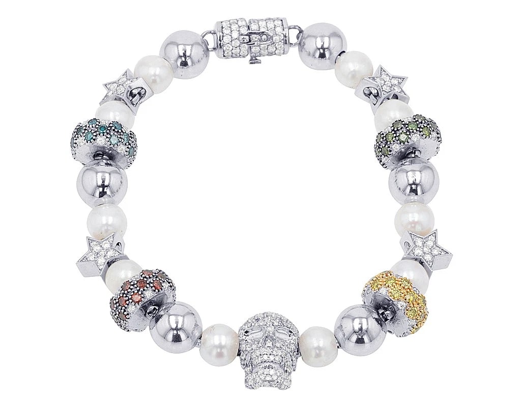 SKULL CENTER MULTI-SHAPE DIAMOND BEAD BRACELET: Skull Center Multi-Shape Diamond Bead Bracelet Brand: None Type: Bracelet Material: 10k White Gold Main Stone/Creation Natural Color: White Gold Size: Length 8" Accessories: None Accessori