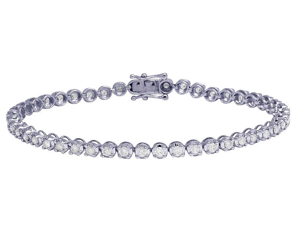 WHITE GOLD TENNIS GENUINE DIAMOND ONE ROW TONI SET BRACELET: White Gold Tennis Genuine Diamond One Row Toni Set Bracelet Brand: None Type: Bracelet Material: 10k White Gold Main Stone/Creation Natural Color: White Gold Size: Dimension 3.5MM 7" Accessories: