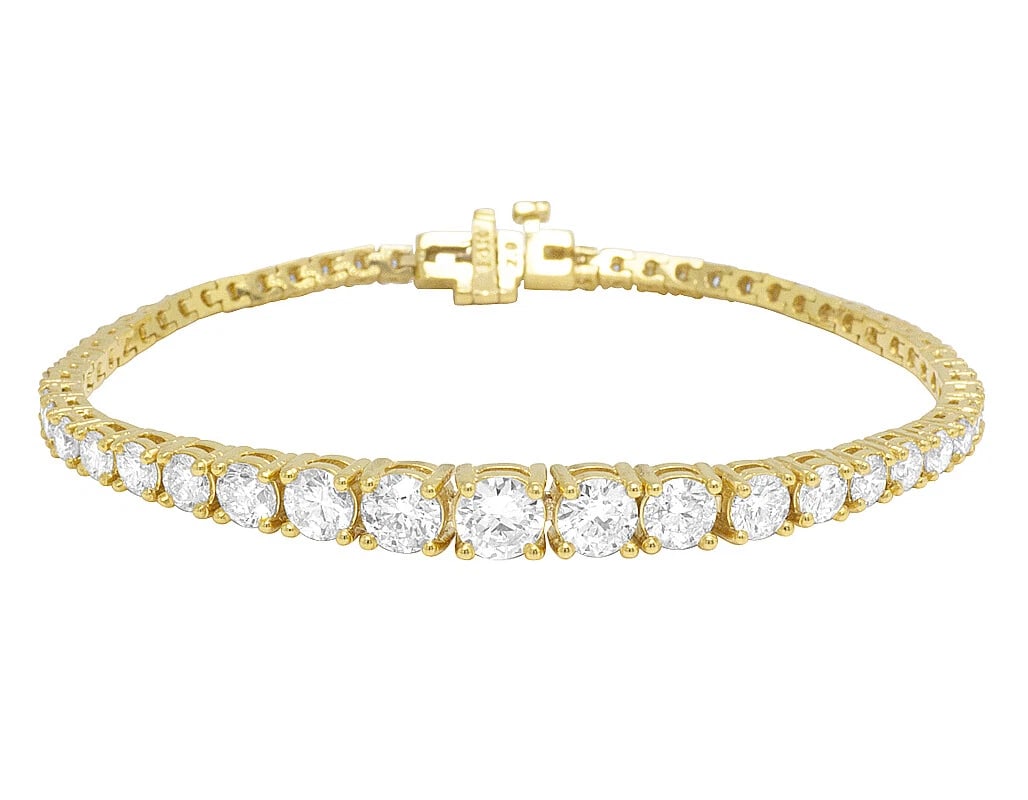 REAL SOLITAIRES 50 POINTER GRADUATING TENNIS BRACELET: Real Solitaires 50 Pointer Graduating Tennis Bracelet Brand: None Type: Bracelet Material: 14k Yellow Gold Main Stone/Creation Natural Color: Main Stone Color White Size: Length 7 in Dimension 6mm