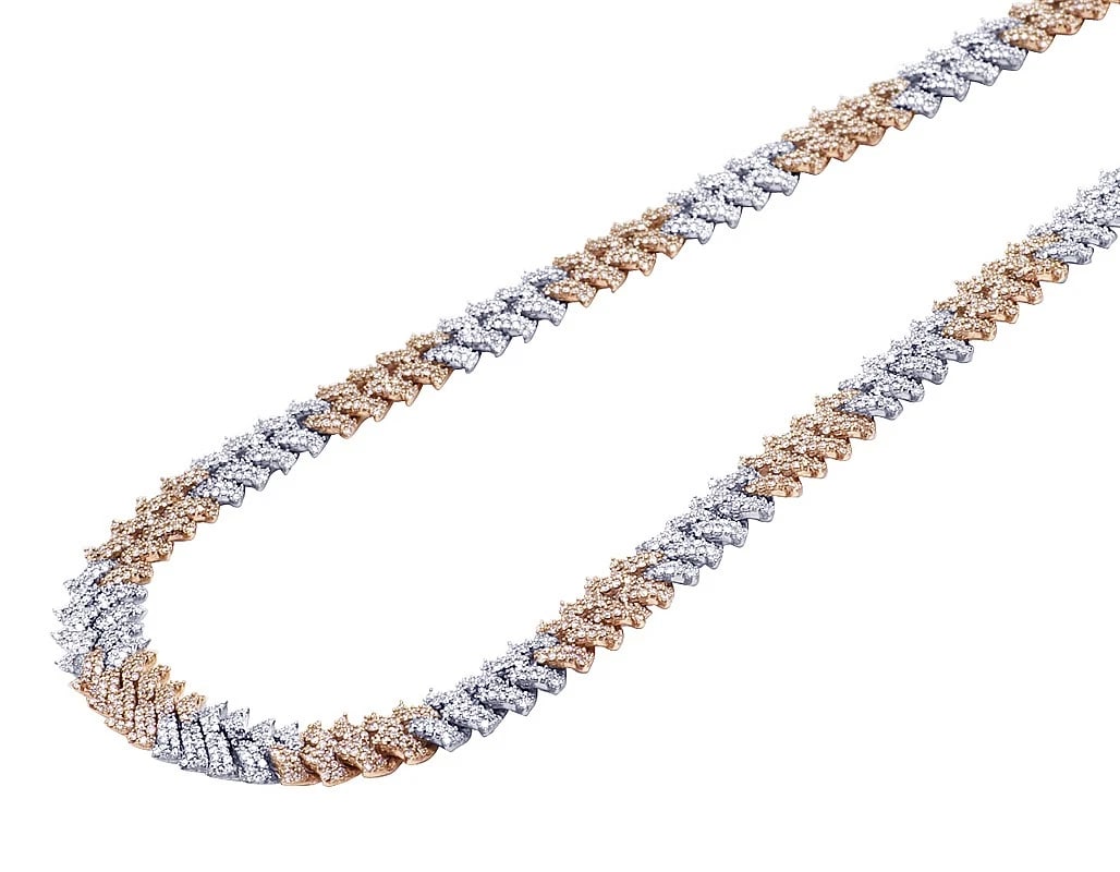 10K TWO-TONE WHITE/ROSE GOLD REAL DIAMOND SPIKEY CUBAN: 10K Two-Tone White/Rose Gold Real Diamond Spikey Cuban Brand: None Type: Necklace Material: 10k Multi-Tone Gold Main Stone/Creation Natural Color: Multi-Tone Size: Length 20" Width 10mm Accessori
