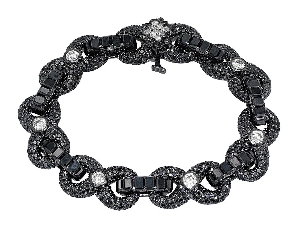 REAL SOLITAIRES 30 POINTER BLACK DIAMONDS BRACELET: Real Solitaires 30 Pointer Black Diamonds Bracelet Brand: None Type: Bracelet Material: 10k White Gold Main Stone/Creation Natural Color: Main Stone Color White Size: Dimension W 12mm, L 7.5" Acc