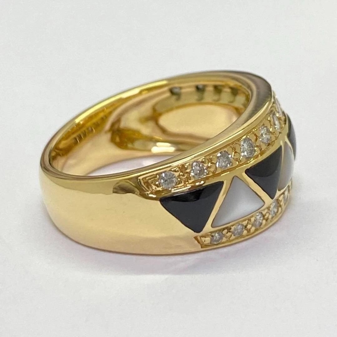 KABANA ONYX MOTHER OF PEARL DIAMOND WIDE BAND INLAY RING: Kabana Onyx Mother of Pearl Diamond Wide Band Inlay Ring Brand: Kabana Type: Ring Material: 18k Yellow Gold Main Stone/Creation Onyx Secondary Stone Natural Color: Yellow Size: 6 US 