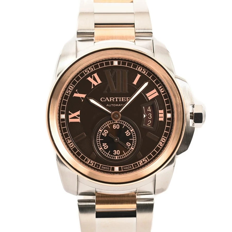 CARTIER CALIBRE BROWN WATCH: CARTIER Calibre Brown Watch Brand: CARTIER Type: Wristwatch Material: Band MaterialStainless Steel/Pink Gold/Bracelet, Band MaterialStainless Steel/Pink Gold/Bracelet, Case MaterialCase