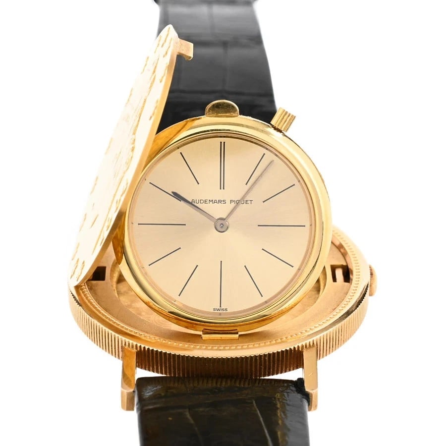 AUDEMARS PIGUET COIN WATCH: AUDEMARS PIGUET Coin Watch Brand: AUDEMARS PIGUET Type: Wristwatch Material: Band MaterialYellow Gold/Leather Strap, Band MaterialYellow Gold/Leather Strap, Case MaterialCase MaterialN/A Color: