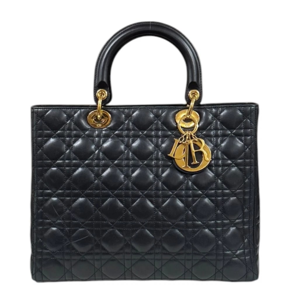 DIOR HANDBAG LEATHER CANAGE LADY DIOR LARGE: Dior Handbag leather Canage Lady Dior Large Brand: Dior Type: Handbag Material/Exterior Material: leather Color/Exterior Color: black Size: W12.4 x H9.4 x D4.5inch Handle:12.6inch 
