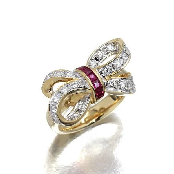 18K YG RIBBON MOTIF RUBY & DIAMOND RING: 18K YG Ribbon Motif Ruby & Diamond Ring Brand: Unbranded Type/Style: Ring Material: K18YG, Main Stone/Creation ruby Color: Gold Size: 6.5US Accessories: None Accessories Notice: When