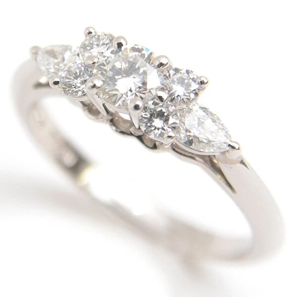 TIFFANY & CO. SEVEN STONE PRONG DIAMOND RING: Tiffany & Co. Seven Stone Prong Diamond Ring Brand: Tiffany & Co. Type/Style: Ring Material: Platinum 950, Main Stone/Creation Natural Color: Silver Size: 4.75US Accessories: None Accessories