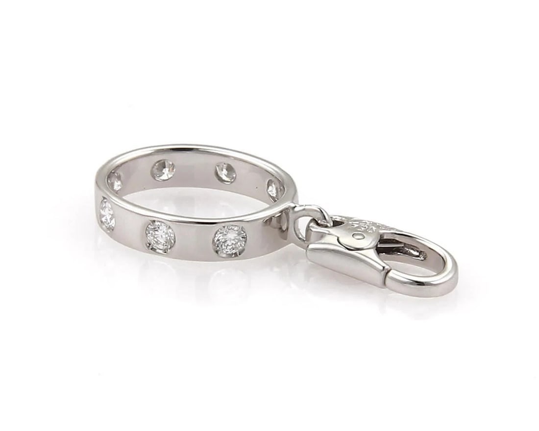CARTIER LOVE 7 DIAMOND 18K WHITE GOLD MINI RING CHARM: Cartier Love 7 Diamond 18k White Gold Mini Ring Charm Brand: Cartier Type: Charm Material: 18k White Gold Color: White Size: Measurement: 1.00" long x .43" wide x 0.11" Accessories: None