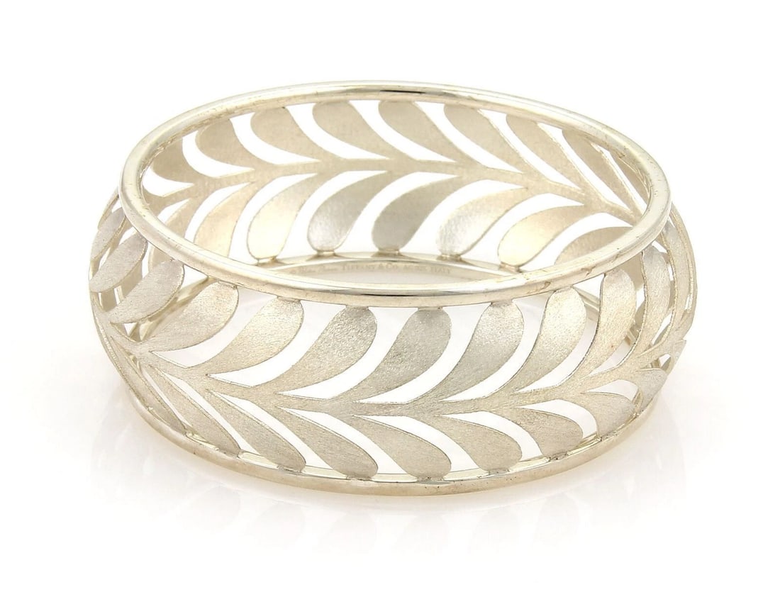 TIFFANY & CO. WIDE VILLA PALM STERLING SILVER BANGLE: Tiffany & Co. Wide Villa Palm Sterling Silver Bangle Brand: Tiffany & Co. Type: Bracelet Material: 925 sterling silver Color: silver Size: Measurement: approximately 7.6" inner circumference x