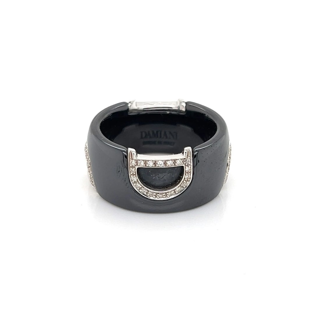 DAMIANI D LOGO DIAMOND BLACK CERAMIC BAND RING: Damiani D Logo Diamond Black Ceramic Band Ring Brand: Damiani Type: Ring Material: 18k white gold and black ceramic Color: none Size: 6 US Accessories: None Accessories Notice: When