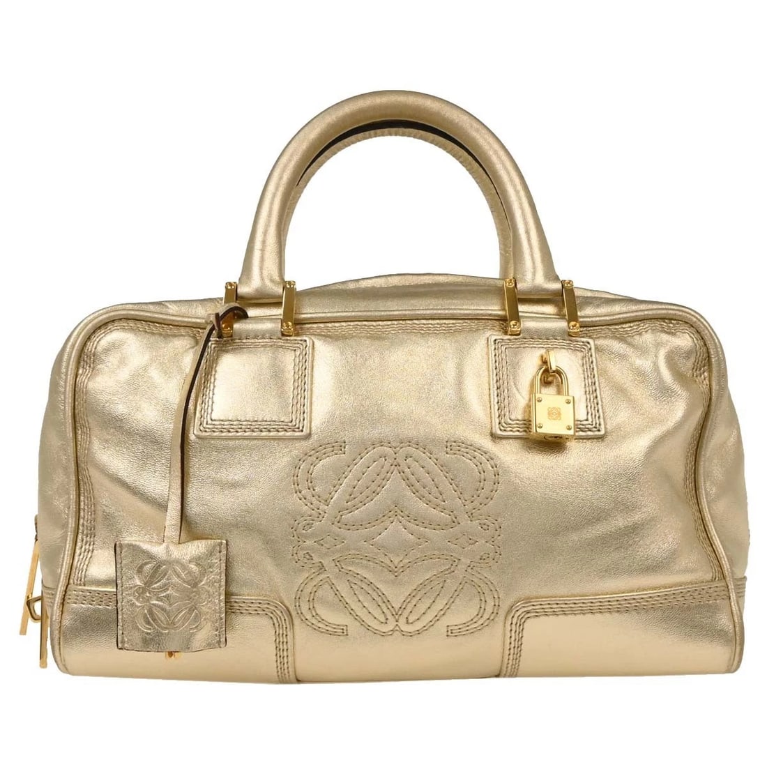 LOEWE METALLIC GOLD LEATHER AMAZONA HANDBAG: Loewe Metallic Gold Leather Amazona Handbag Brand: Loewe Type: Top Handle Bag Material/Exterior Material: Leather Color/Exterior Color: Metallic Gold Size: W 11.4 x H 6.3 x D 5.1 " Handle Drop. 3.
