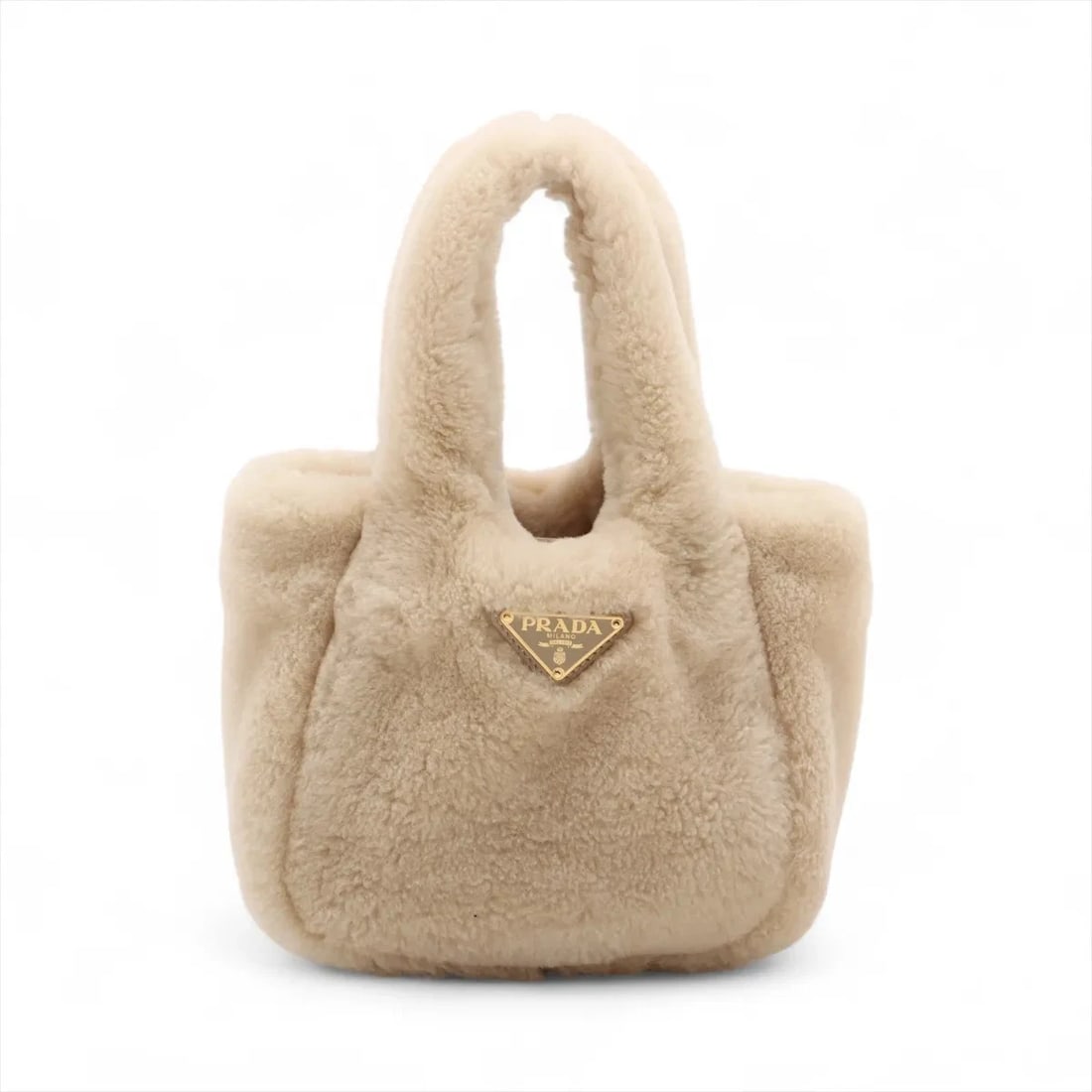 PRADA SHEARING HAND BAG: Prada Shearing Hand bag Brand: Prada Type: Hand bag Material: Shearing Color: Beige Size: Height:6.3inch Length:7.5inch Depth:2.6inch Handle height:4.7inch Accessories: None Accessories No