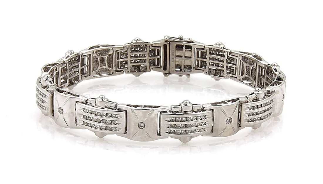 CHANNEL SET DIAMONDS 14K WHITE GOLD CURVED LINK BRACELET: Channel Set Diamonds 14k White Gold Curved Link Bracelet Brand: Unbranded Type: Bracelet Material: 14k white gold Color: None Size: Measurement: 8" long and 13.5mm wide x 4.5mm high Accessories: