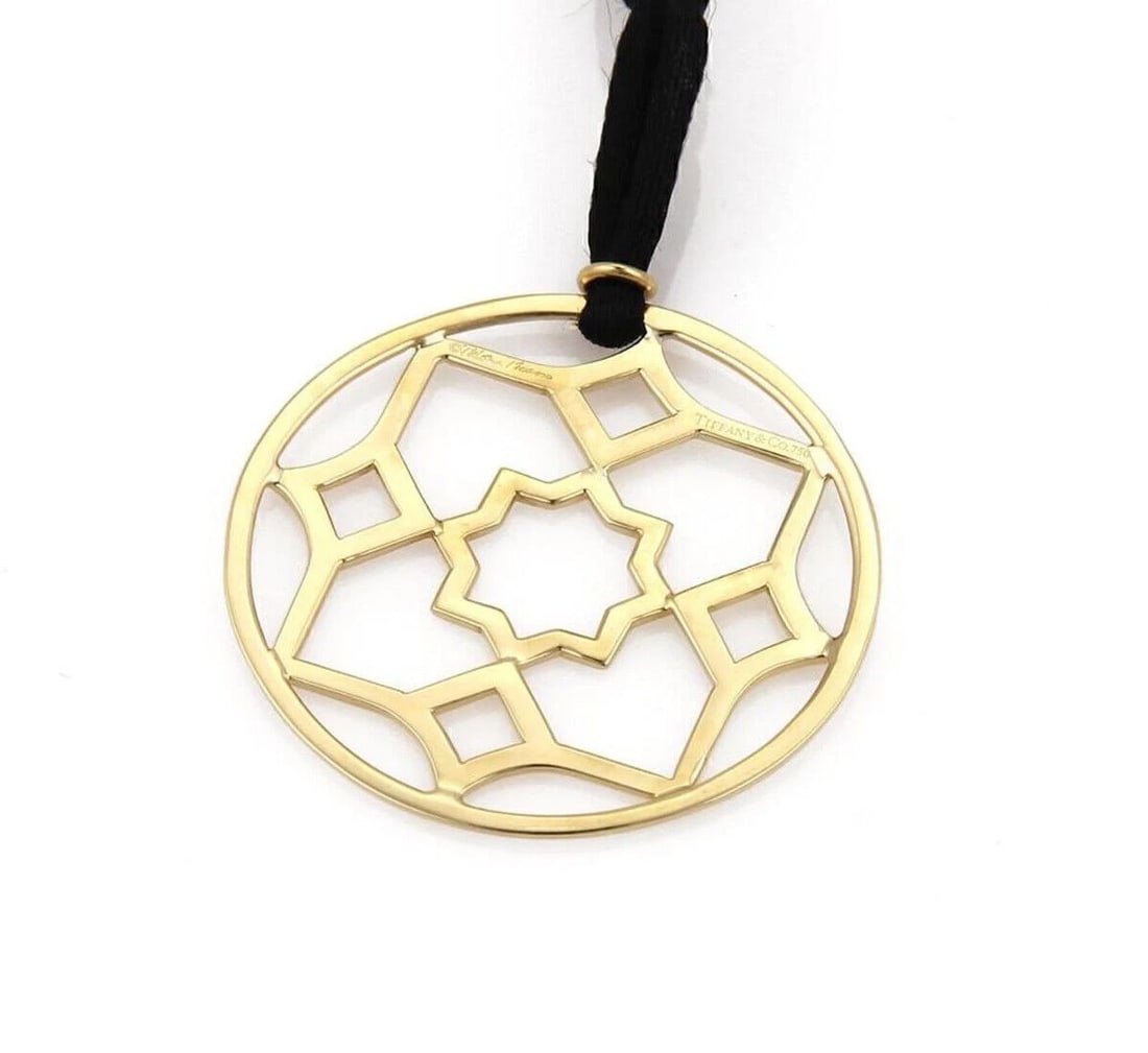 TIFFANY & CO. PICASSO 18K GOLD PENDANT & CORD PENDANT NECKLACE: Tiffany & Co. Picasso 18k Gold Pendant & Cord Pendant Necklace Brand: Tiffany & Co. Type: Necklace Material: 18k yellow gold Color: Yellow Size: Measurement: Chain is: 26" Accessories: None