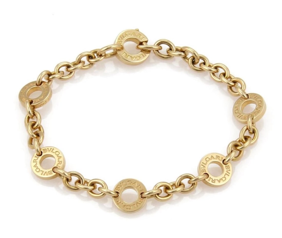 BVLGARI 6 ENGRAVED CIRCLE STATION CHAIN BRACELET: Bvlgari 6 Engraved Circle Station Chain Bracelet Brand: Bvlgari Type: Bracelet Material: 18k yellow gold Color: None Size: Measurement:6.25" long x 0.32" wide x 0.18" high Accessories: None