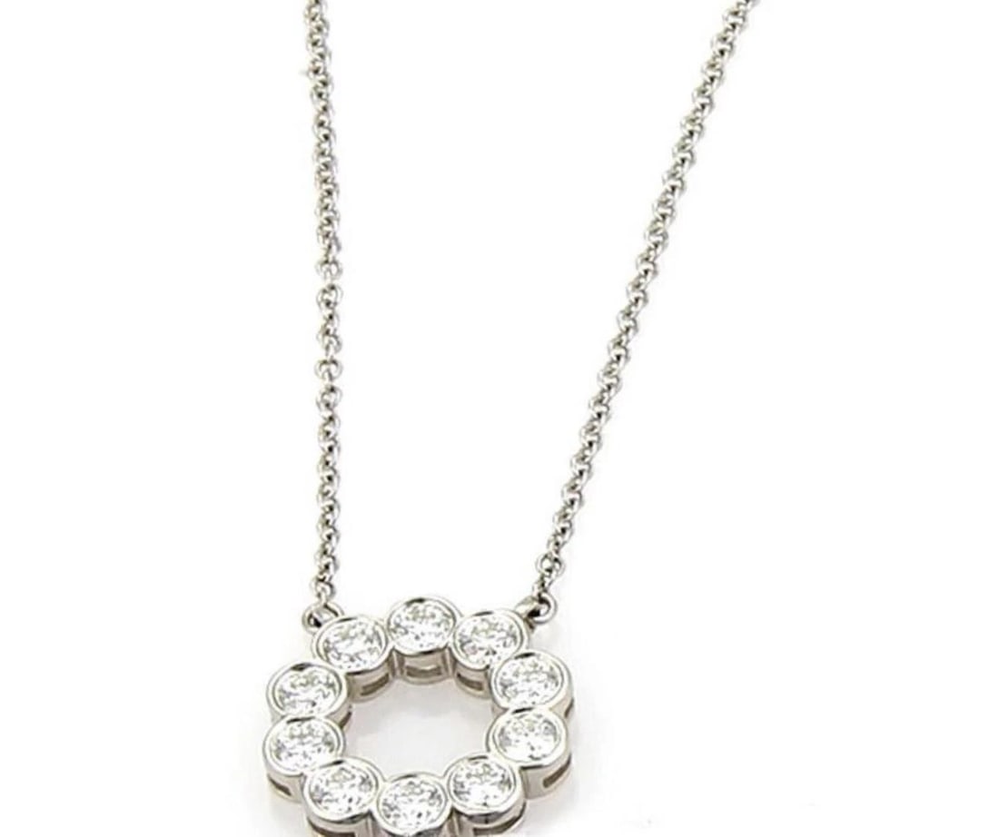 TIFFANY & CO. CIRCLE DIAMOND PLATINUM PENDANT NECKLACE: Tiffany & Co. Circle Diamond Platinum Pendant Necklace Brand: Tiffany & Co. Type: Necklace Material: 950 platinum Color: platinum Size: Pendant: 12mm round x 2mm thick chain length: 16" 
