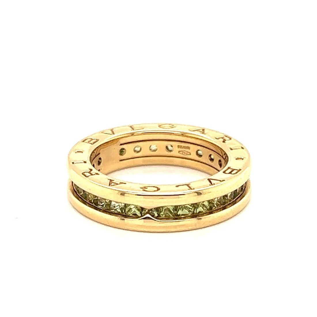 BVLGARI B.ZERO1 GREEN PERIDOT ETERNITY BAND RING: Bvlgari B.zero1 Green Peridot Eternity Band Ring Brand: Bvlgari Type: Ring Material: 18k yellow gold Main Stone/Creation/Gemstone Gemstone: peridot Color: None Size: US 5 Accessories: None