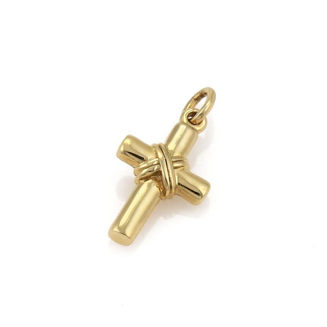 TIFFANY & CO. X WRAPPED CROSS CHARM PENDANT: Tiffany & Co. X Wrapped Cross Charm Pendant Brand: Tiffany & Co. Type: Pendant Material: 18k yellow gold Color: yellow Size: Measurement: 1.03" long w/bail x 0.50" x 019" high Accessories: None